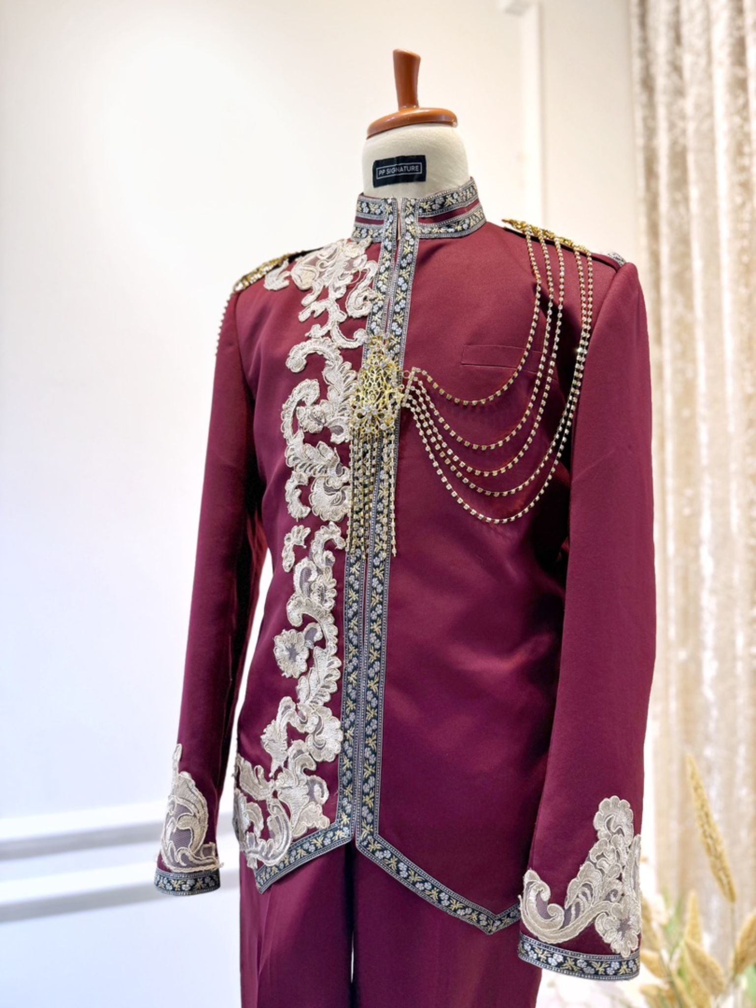 Look like royalty for your wedding day! Sewaan this prince suit in maroon with light brown lace for a timeless & sophisticated look.