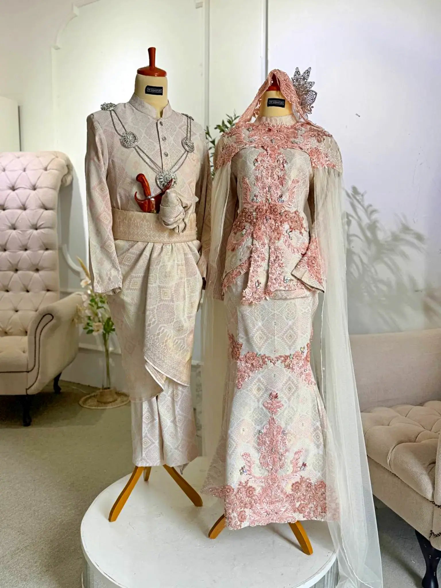 SHELLY - Light Peach & Cream Songket 3D Baju Pengantin from Butik Pengantin PP Signature. A stunning two-piece wedding dress with a detachable shoulder cape, perfect for a traditional Malay wedding reception.