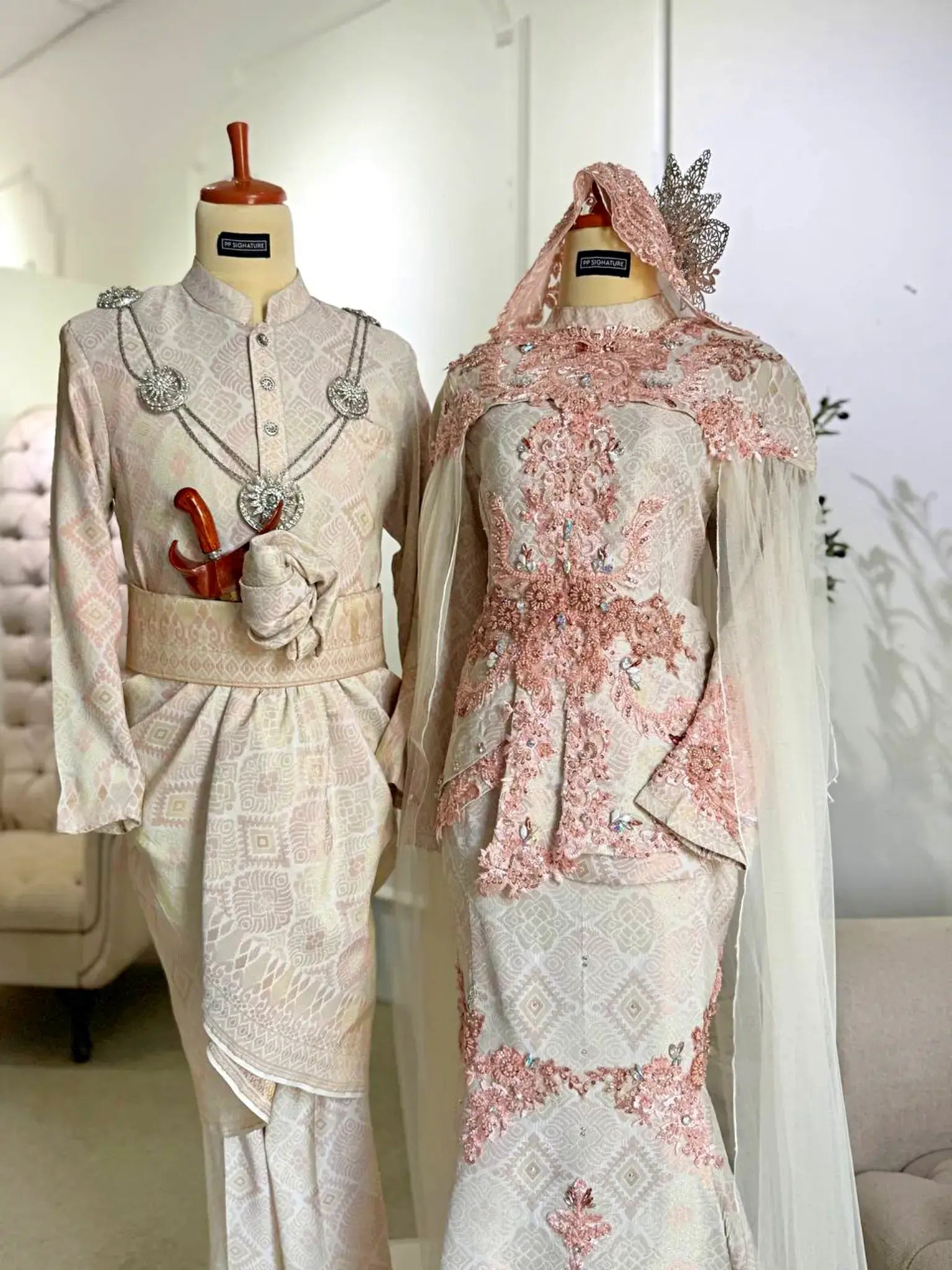 SHELLY - Light Peach & Cream Songket 3D Baju Pengantin from Butik Pengantin PP Signature. A stunning two-piece wedding dress with a detachable shoulder cape, perfect for a traditional Malay wedding reception.