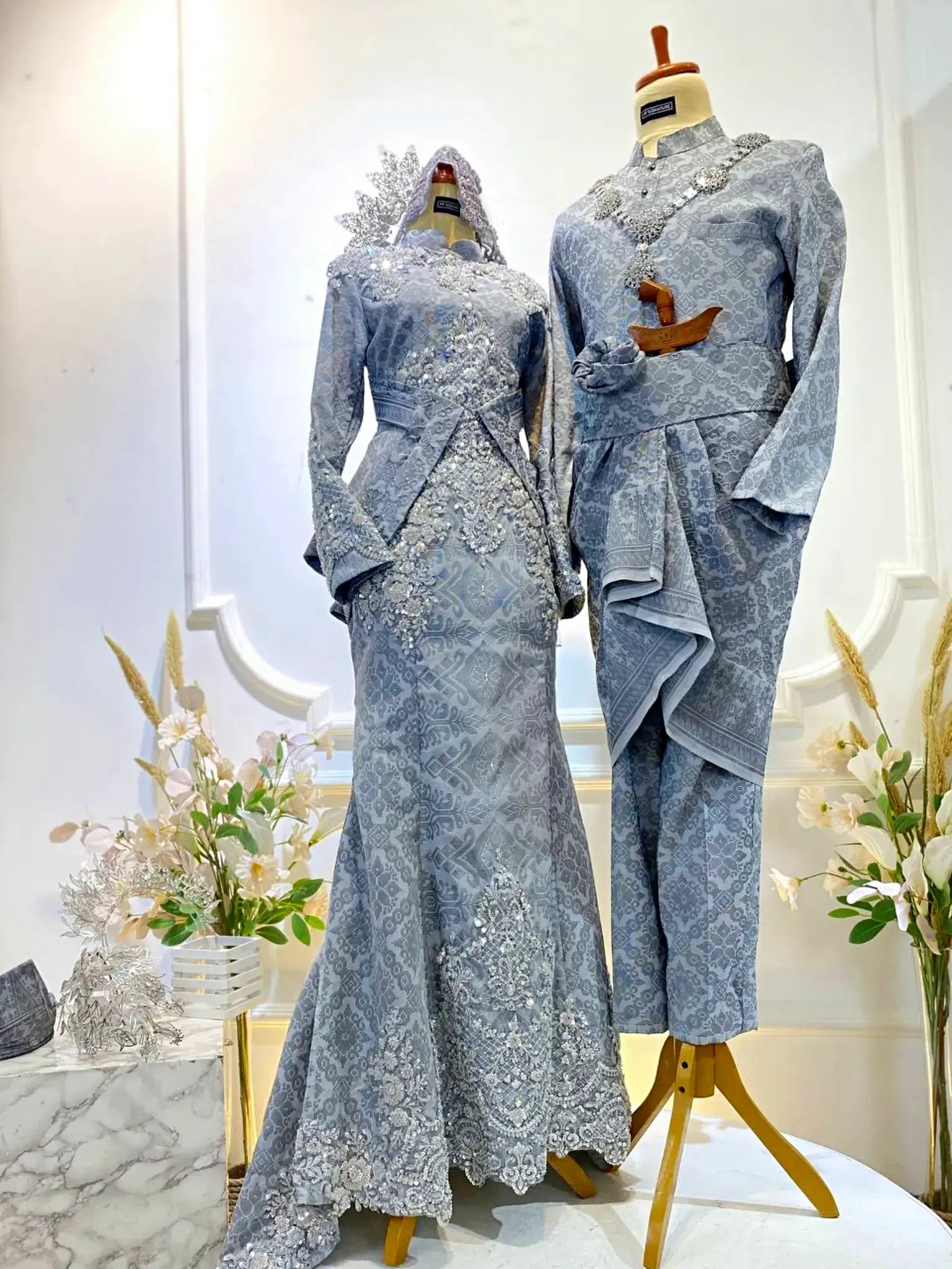 Sufina Baju Sanding Light Grey – Malay wedding dress & Kot Raihan suit for bride and groom rental.